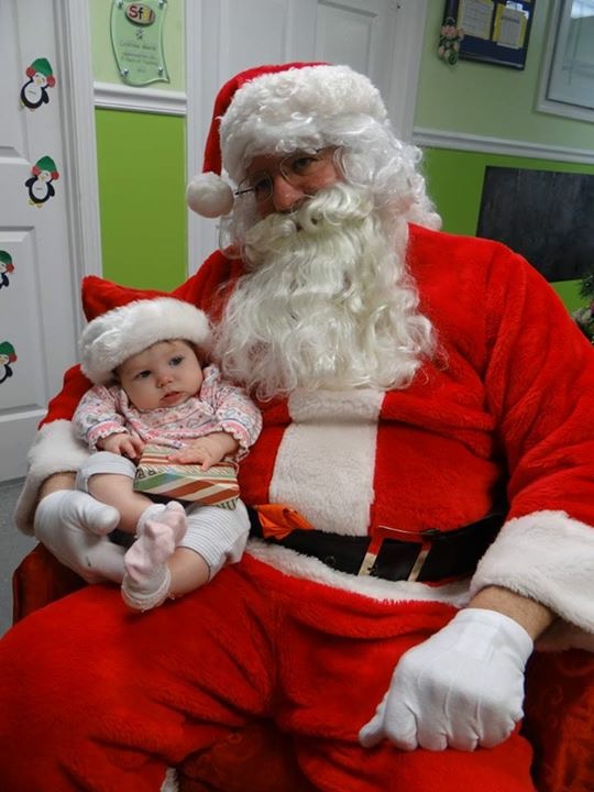 Brynn with daycare Santa